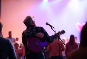 Cole Swindell performing during a tribute to Charlie Kirk